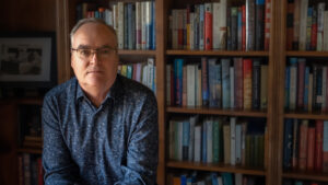 Portrait of Terry Fallis, author, in library