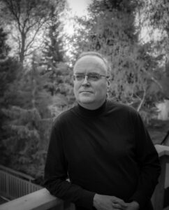 Photo of Terry Fallis outdoors in greyscale